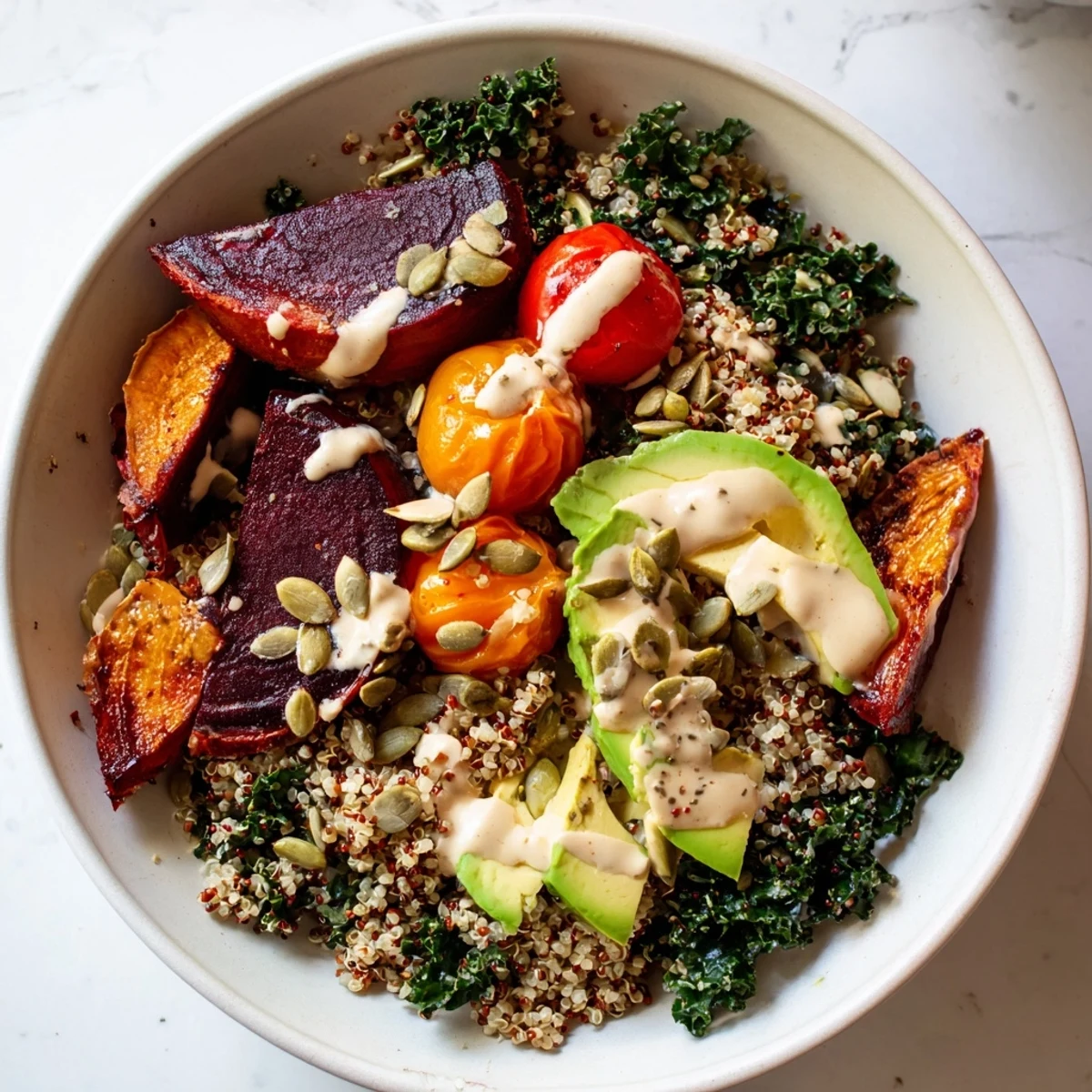 Fluffy quinoa, bright kale, and roasted beets make this Quinoa, Kale & Roasted Beet Bowl a delicious vegetarian meal.