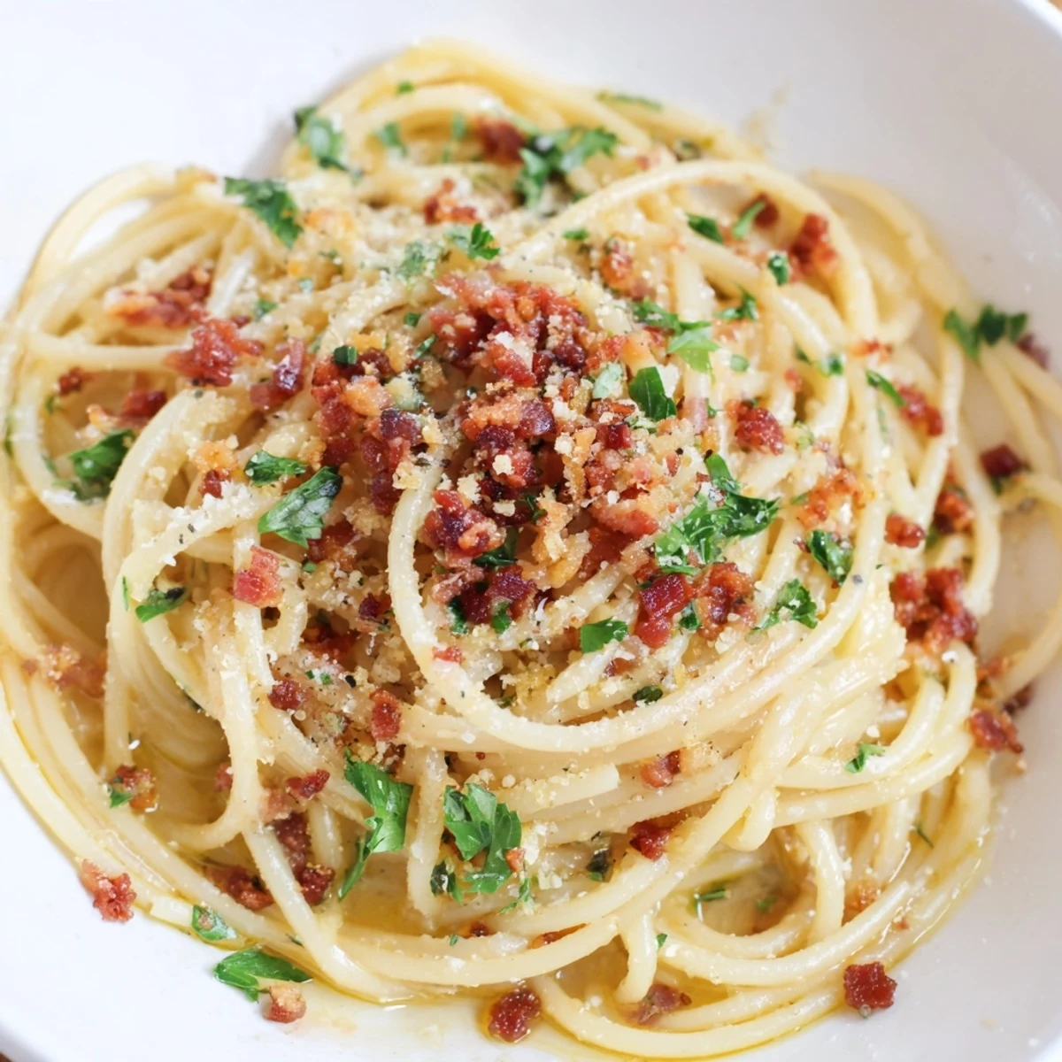 Creamy Garlic Butter Pasta, perfectly coated, topped with smoky bacon bits, ready to enjoy.
