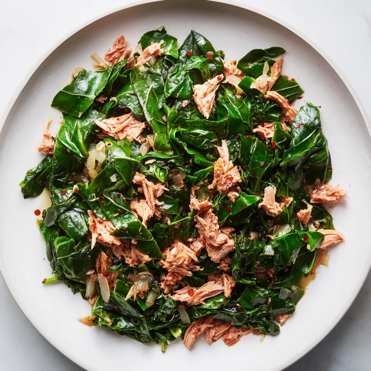 A close-up of flavorful Southern-style collard greens, simmered with smoky turkey for perfect comfort food.