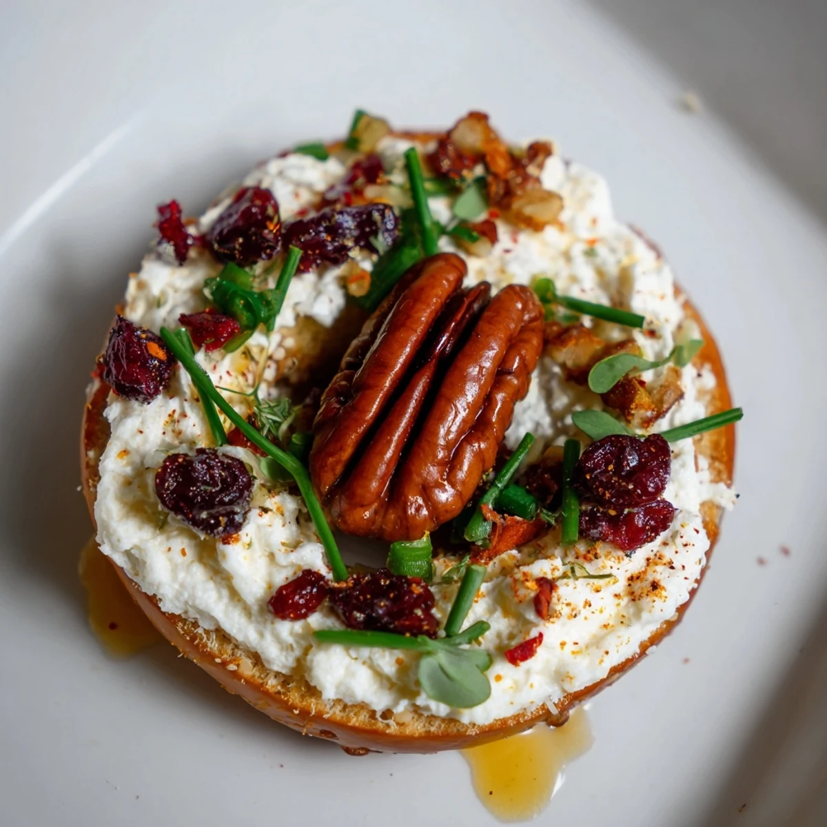 Festive Rocket Fuel New Year's Eve Treats—salty pretzels topped with sweet cream cheese and crunchy cranberries.