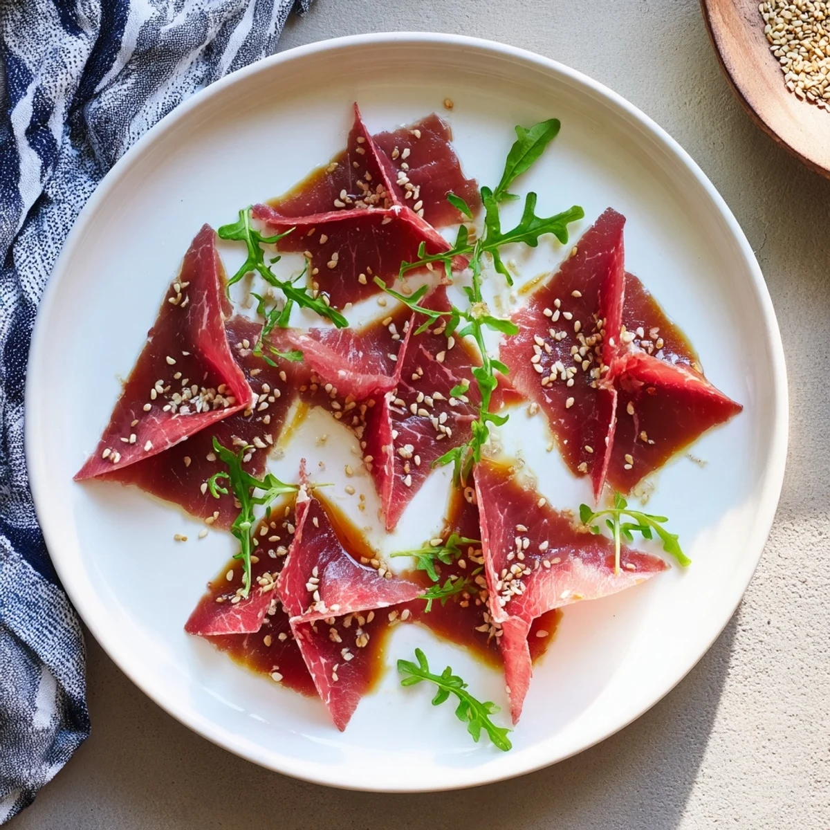 Savory Origami Fold Beef Appetizer: geometric beef folds sprinkled with sesame seeds, a gluten-free dream.