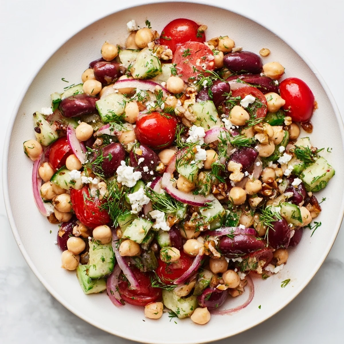 A close-up of the delicious Dense Bean Salad, featuring hearty beans and fresh herbs for a filling meal.