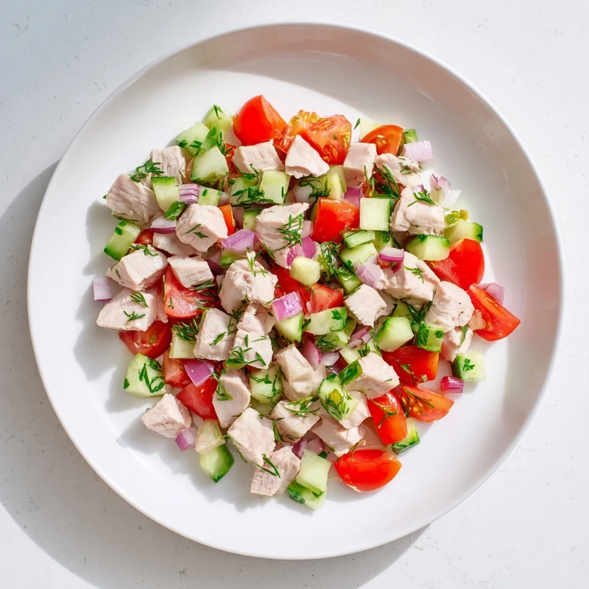 This Clean Shaker Cucumber and Chicken salad showcases a light, refreshing meal with a zesty dressing.