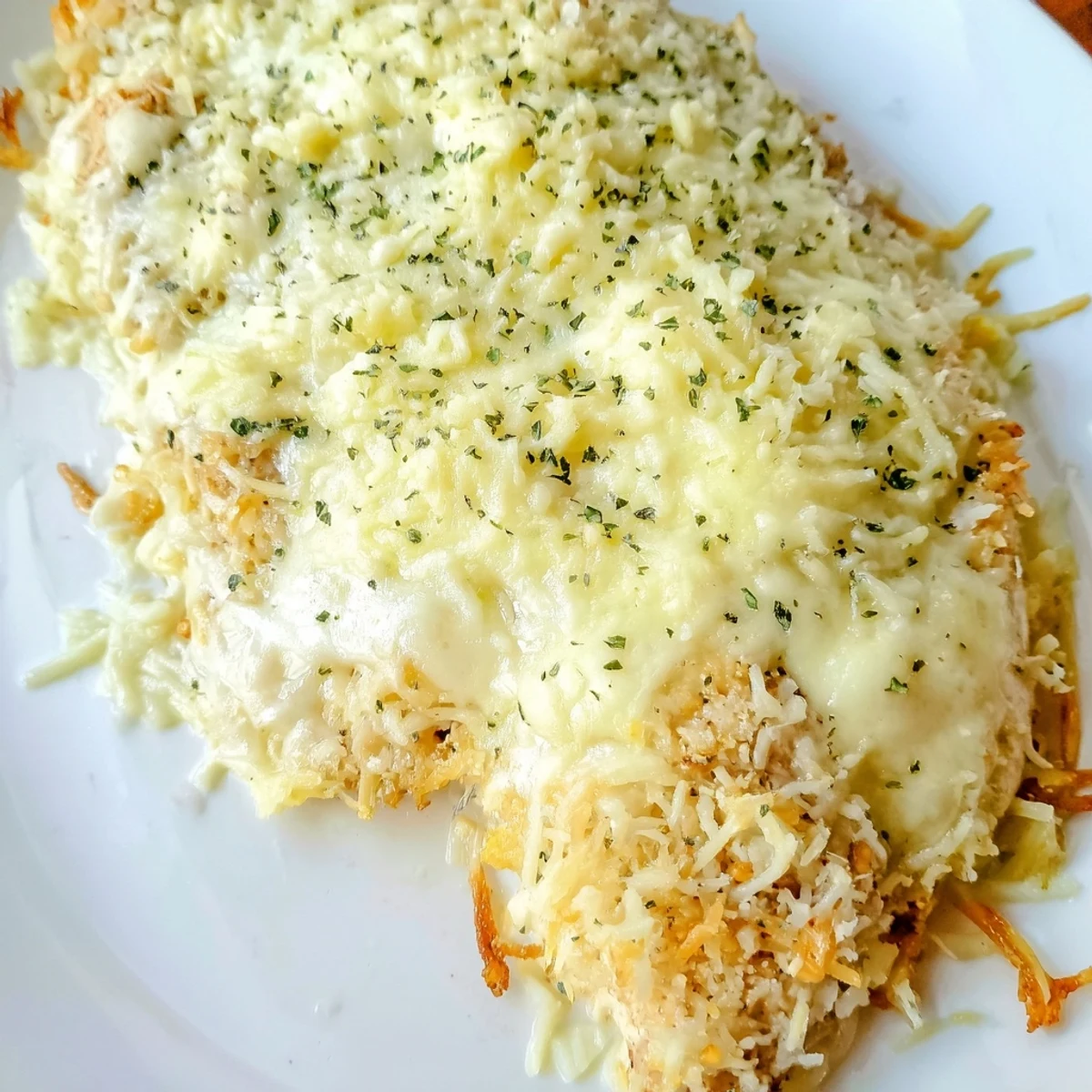 Golden, bubbly Cheesy Baked Chicken Breast, a comforting American dinner with melted cheese and crispy topping.