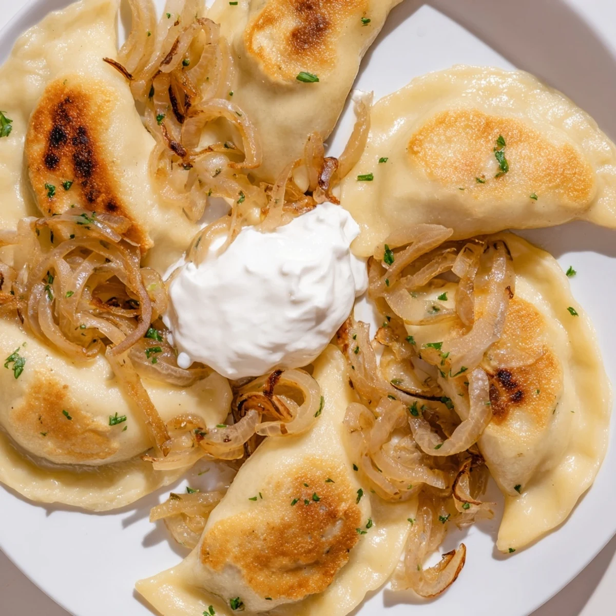 Delicious, homemade Polish pierogi with potato and cheese filling, ready to be enjoyed with family.