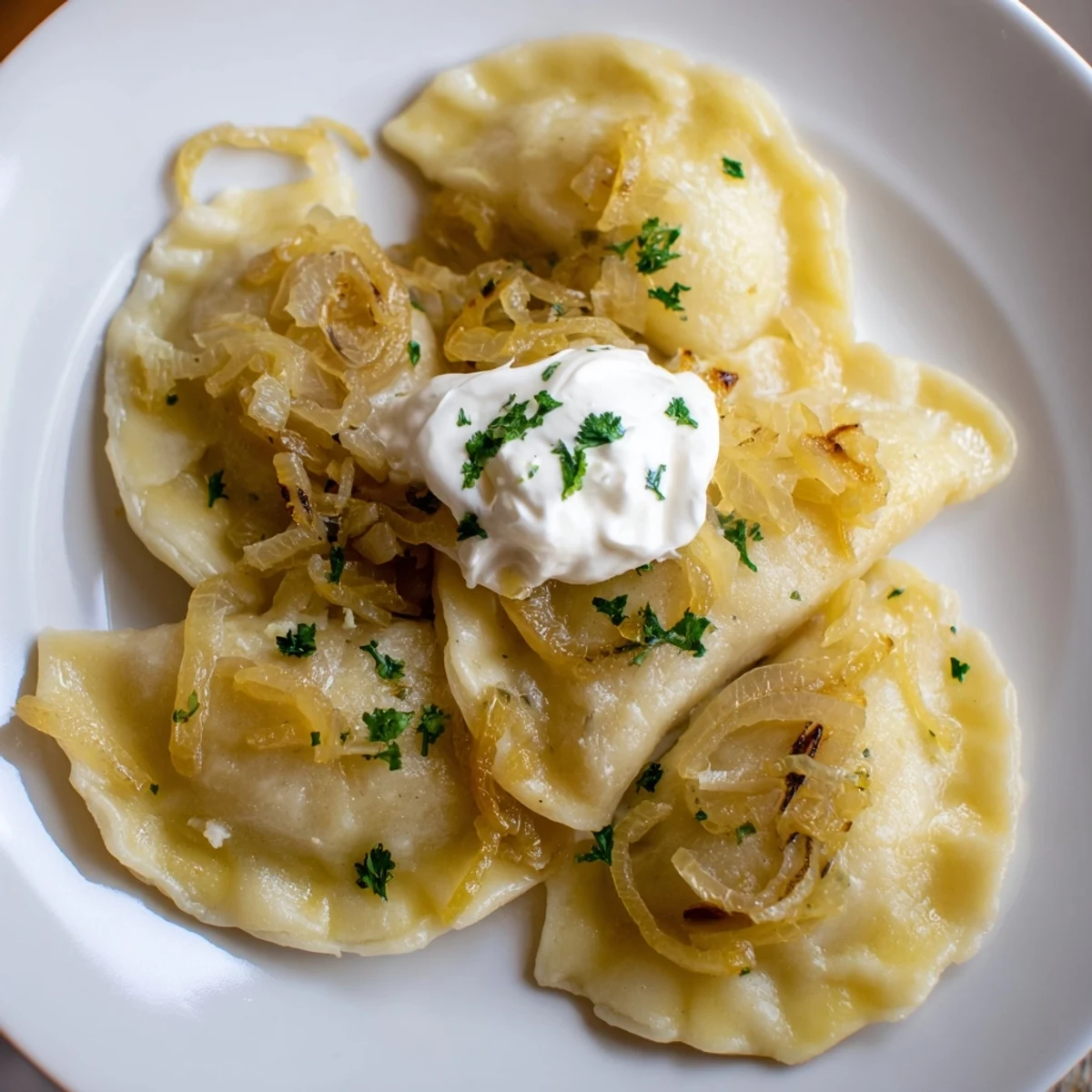 Close-up of freshly cooked Polish pierogi, a savory dumpling filled with creamy potato and melting cheese.