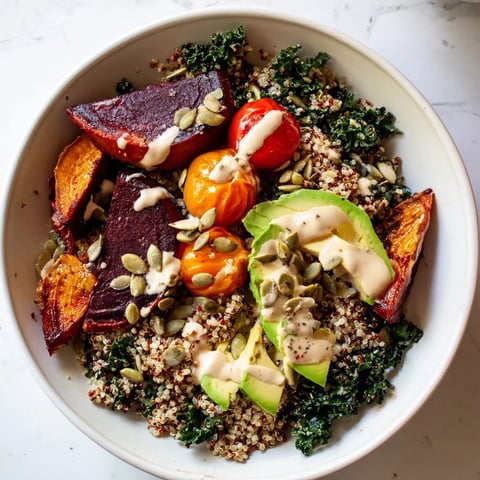 Fluffy quinoa, bright kale, and roasted beets make this Quinoa, Kale & Roasted Beet Bowl a delicious vegetarian meal.