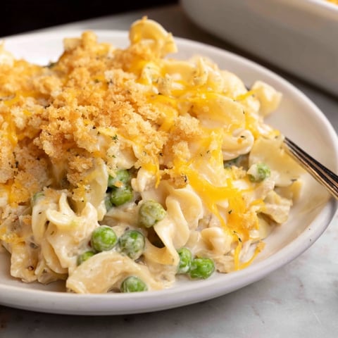 Golden brown Creamy Tuna Noodle Casserole with a crispy Ritz cracker topping, ready to serve!