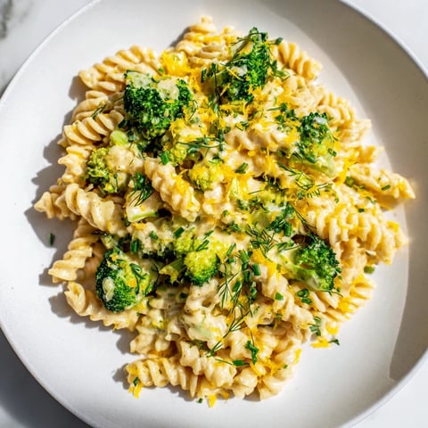 Green Goddess Broccoli Cheddar One-Pot Pasta bubbly in a pot, ready to be served.