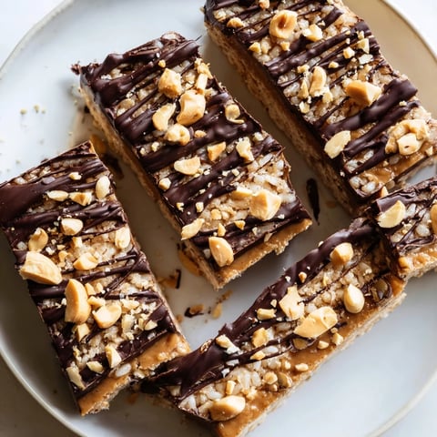 Peanut butter chocolate rice cakes: A close-up shows chilled, dark chocolate drizzled over peanut butter.