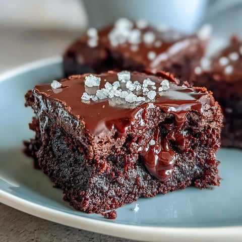 Rich, fudgy sourdough discard brownies topped with flaky sea salt for a perfect balance of sweet and salty flavors.