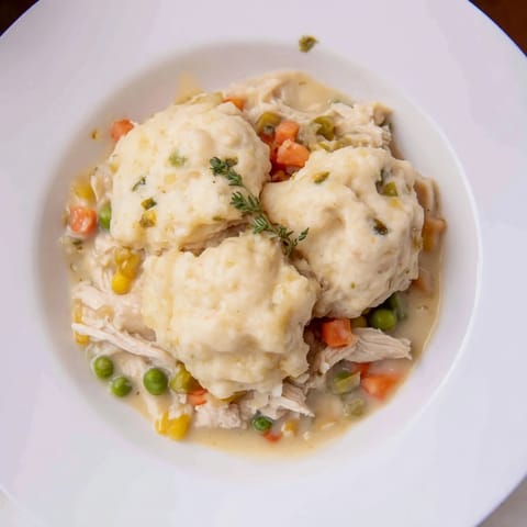 Deliciously creamy Chicken and Dumplings Casserole with fluffy dumplings, perfect for a cozy, comforting supper.