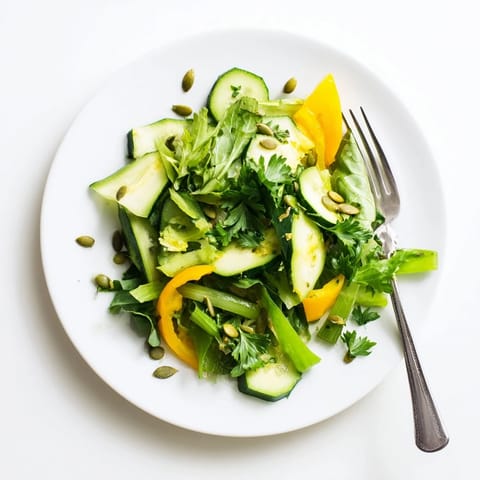 Fresh Glowing Green Salad tossed with mixed greens and bell peppers, dressed in a light, tangy vinaigrette.