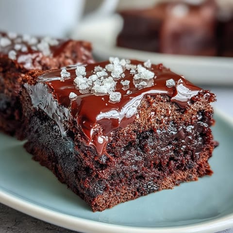 Decadent dark chocolate brownies with a subtle tang from sourdough discard, finished with a sprinkle of sea salt crystals.