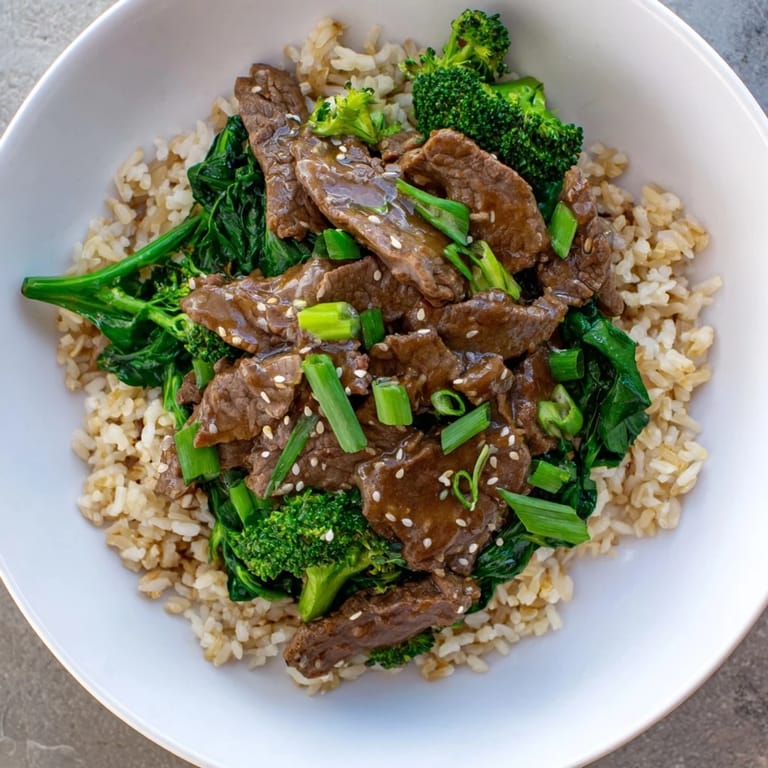 Close-up photo of steaming Slow-Cooker Beef & Broccoli: a complete, delicious, and easy Asian-inspired dish.
