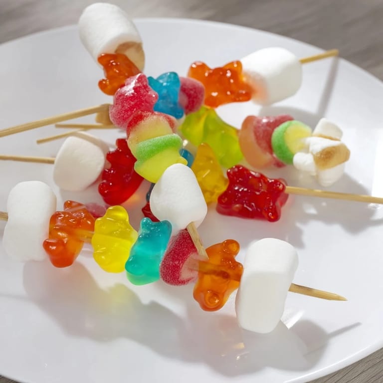 Close-up of sweet, colorful gummy candy kabobs arranged on a platter, a perfect party dessert.
