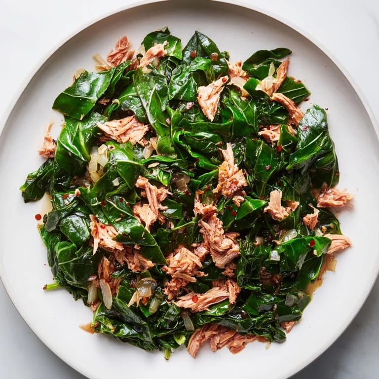 A close-up of flavorful Southern-style collard greens, simmered with smoky turkey for perfect comfort food.