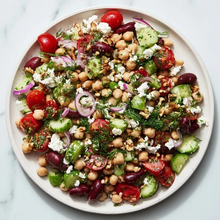 This refreshing Dense Bean Salad combines colorful vegetables with a tangy Sleepy Girl Mocktail dressing.