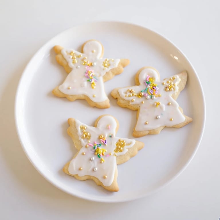 Festive Biscuits Anges de Noël, delicate French angel cookies, offering sweetness and buttery flavor.