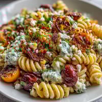Vibrant Elote Pasta Salad with Cotija, chili, and lime, showcasing creamy corn, fresh cilantro, and zesty dressing.